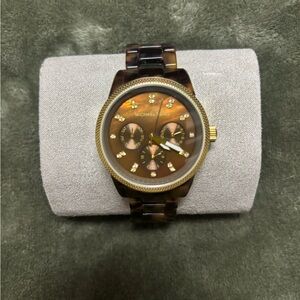 Michael Kors tortoise watch. Very lightweight.